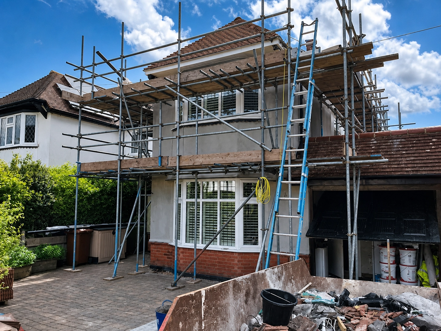Two-storey exterior render with scaffolding